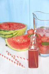 Carafe with watermelon, strawberry syrup, ice and mint, glass bottle with drinking straw - YFF000441