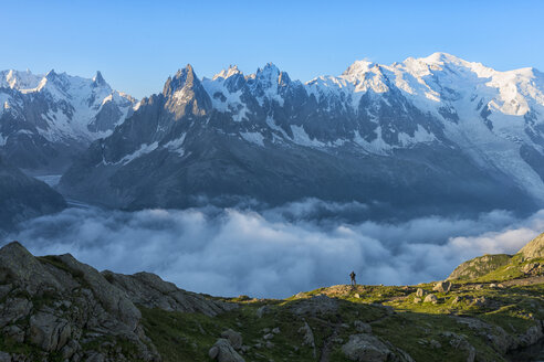 France, Mont Blanc, Lake Cheserys, hiker in front of Mount Blanc at sunrise - LOMF000026