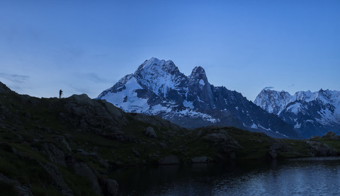 France, Mont Blanc, Lake Cheserys, photographer on a peak stock photo