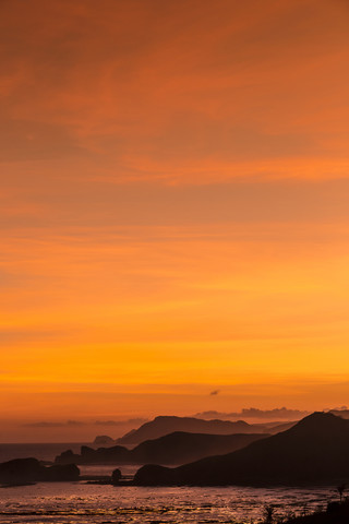 Indonesia, Bali, Coastline of Lombok island at sunset stock photo