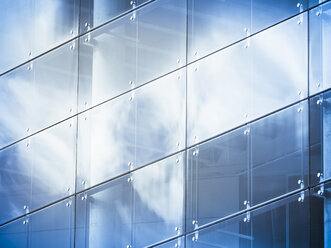 Germany, Hamburg, office building, glass facade, reflection of cloud - KRPF001445