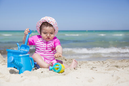 Spain, Majorca, baby girl playing on the beach - ROMF000063