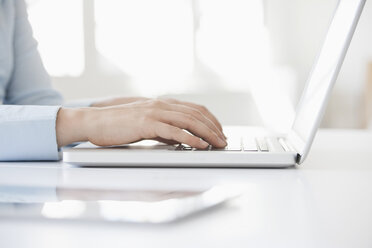 Close-up of woman's hands using laptop - RBF002906