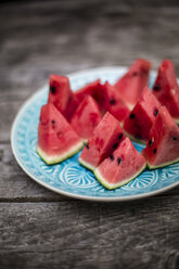 Chopped watermelon on blue plate - SARF001980