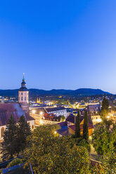 Germany, Baden-Wuerttemberg, Baden-Baden, Cityscape with collegiate church in the evening - WDF003161