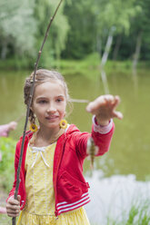 Germany, Girl with rod and small fish - MJF001541