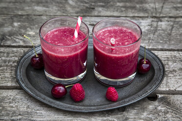 Red smoothie in glasses, raspberry, cherry on wood - SARF001992