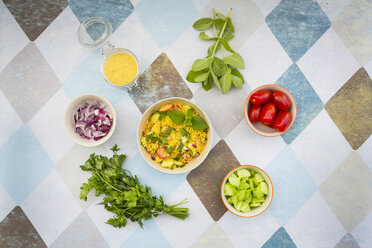 Bowl of prepared couscous salad and ingredients - LVF003592