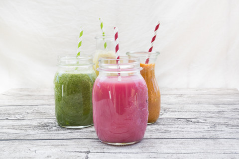 Four glasses of different smoothies stock photo