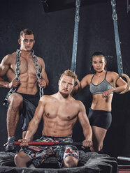 Three CrossFit athletes posing - MADF000326