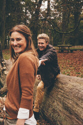 Happy young couple in an autumnal park - CHAF000206