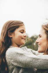 Little girl hugging her mother - CHAF000248