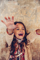 Happy girl stretching out her arms - CHAF000342