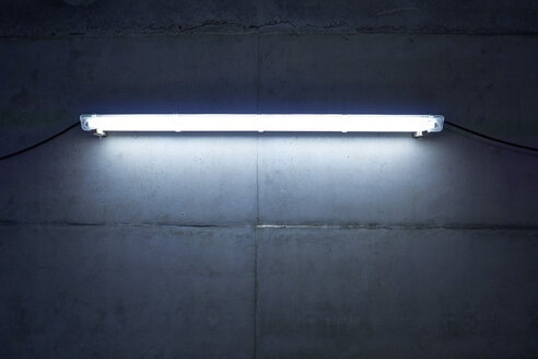 Neon light at concrete wall - FMKF001571