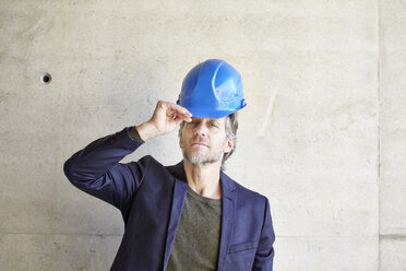 Portrait of confident architect on construction site - FMKF001642