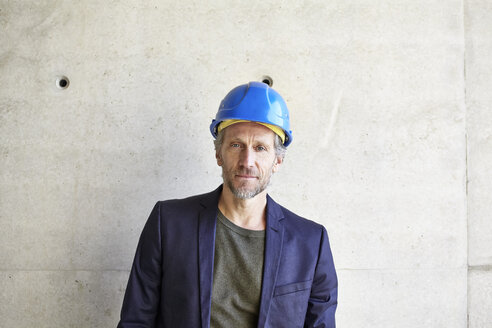 Portrait of confident architect on construction site - FMKF001643