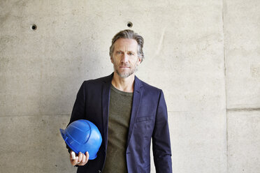 Portrait of confident architect on construction site - FMKF001644