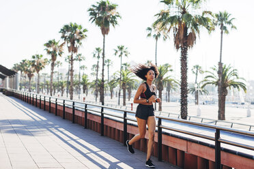 Spain, Barcelona, jogging young woman - EBSF000719