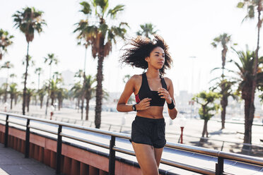 Spain, Barcelona, jogging young woman - EBSF000720