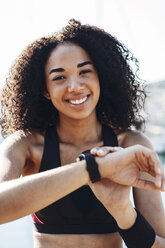 Spain, Barcelona, portrait of smiling jogger - EBSF000731