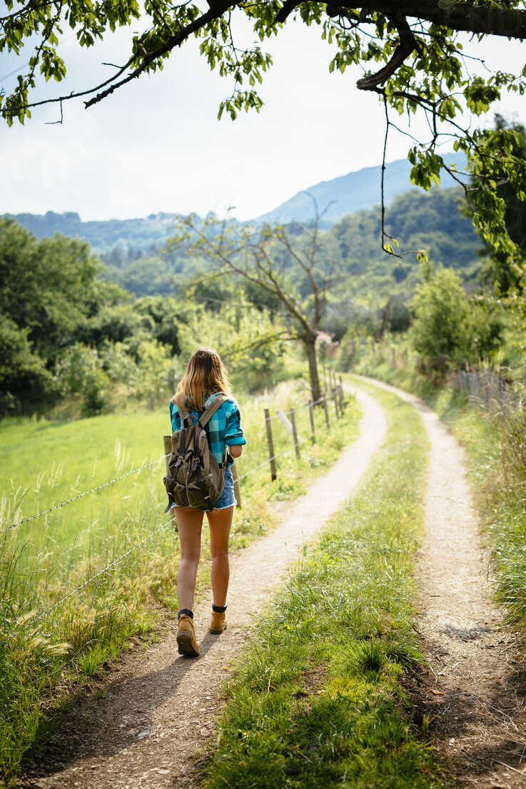 Alto Adige, teenage girl hiking on a path stock photo