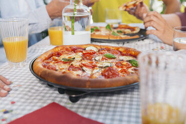 Homemade pizza on a table - MFF001709