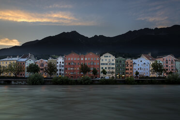 Austria, Tyrol, Innsbruck, colorful houses in front of Nordkette mountains - MKFF000235