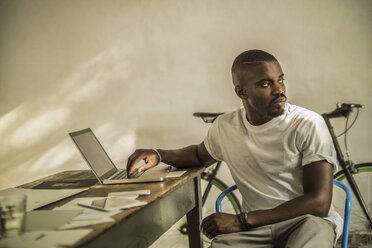 Portrait of young man in his studio - RIBF000120