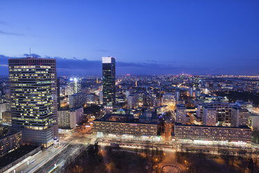 Poland, Warsaw, view to the city centre at evening twilight - ABOF000031