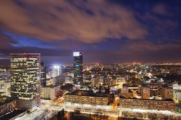 Poland, Warsaw, view to the city centre at evening twilight - ABOF000033