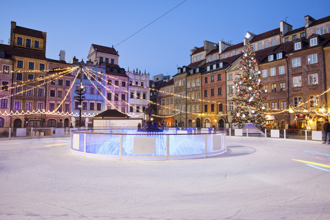 Poland, Warsaw, old town square with ice rink during Christmas time in the evening stock photo