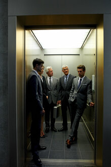 Group of businesspeople in an elevator - CHAF000387