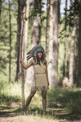 Young woman masquerade as an Indian standing in the woods - ASCF000214