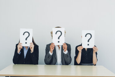 Business people with question mark on placards - CHAF000517