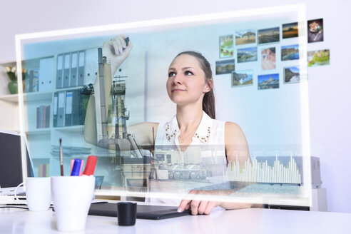Designer with a virtual futuristic computer at work - VTF000427