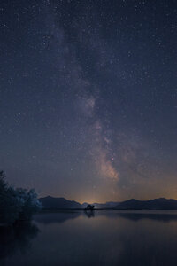 Germany, Bavaria, Chiemgau, Lake Chiemsee at night, starry sky - HAMF000053