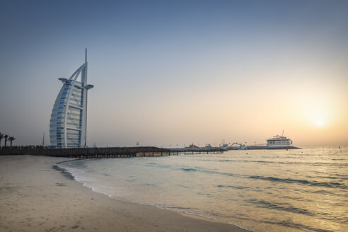 United Arab Emirates, Dubai, Sunset at Jumeirah Beach with Burj al Arab and Jumeirah Beach Hotel - NKF000288