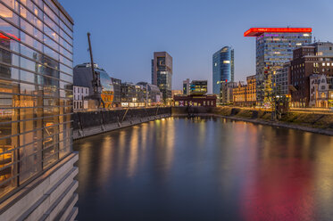 Germany, Duesseldorf, Media harbour at Lido Restaurant, blue hour - FR000278