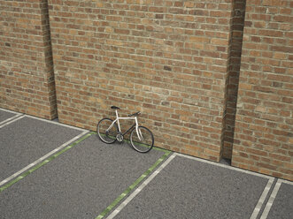 Racing cycle on parking lot leaning at brick wall, 3D Rendering - UWF000557