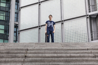 Germany, Berlin, teenage boy with skateboard - MMFF000877