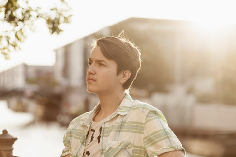 Germany, Berlin, portrait of pensive teenage boy stock photo