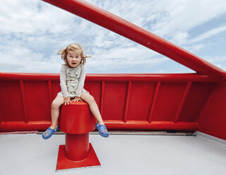 Little girl having fun on a red ferry - IPF000222