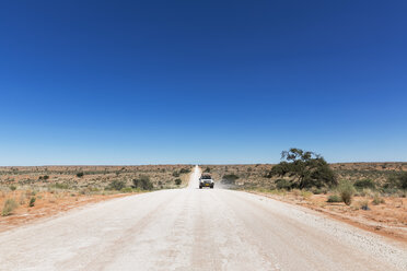 Namibia, Kalahari, off-road vehicle driving on gravel road - FOF008191