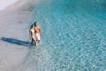 Spain, Majorca, couple wading in the sea - CHAF000666