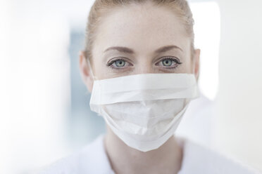 Portrait of nurse in hospital wearing mask - ZEF006067