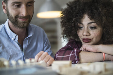 Smiling man and woman in office - FKF001229