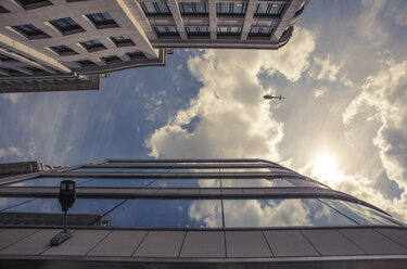 UK, London, facades of office towers at financial district and helicopter seen from below - ZMF000427