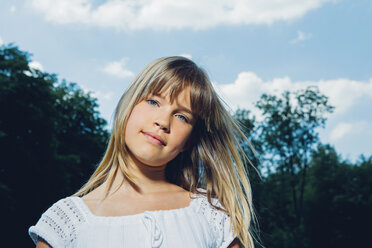 Portrait of smiling little girl in nature stock photo