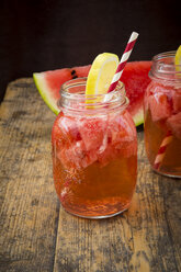 Glasses of homemade watermelon lemonade on wood - LVF003731