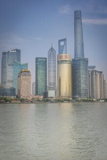 China, Shanghai, Jinmao Building, World Financial Center and Shanghai Tower peaking out of the Pudong Skyline - NKF000319